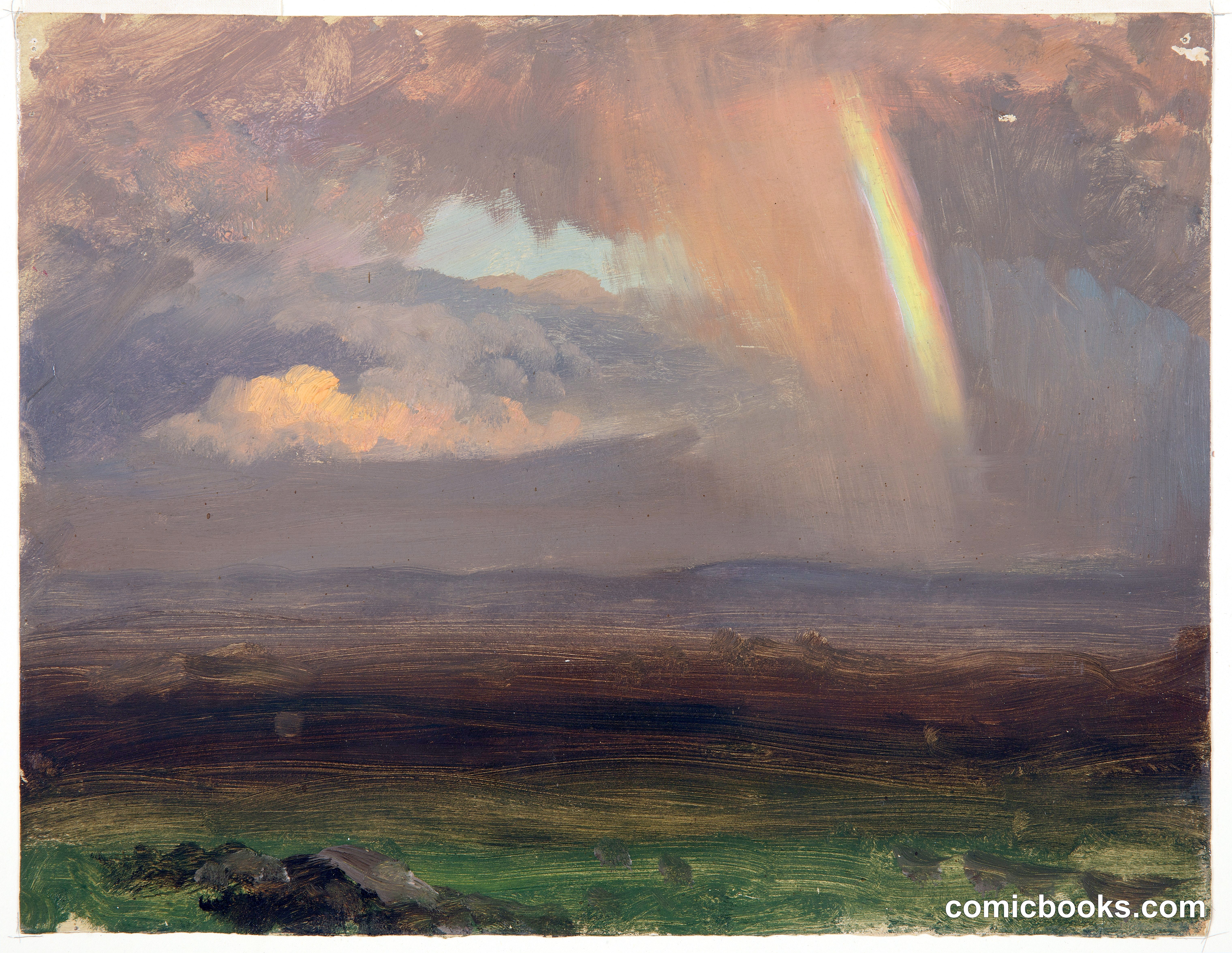 Clouds and Rainbow over a Mountain Valley