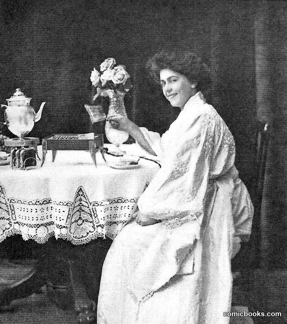 Woman at Breakfast Table with Electric Appliance